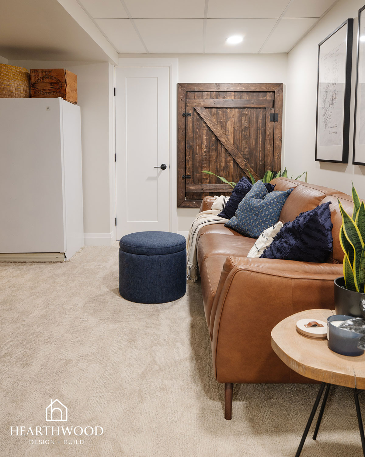 Parkland County basement renovations  - a cozy living space featuring a brown leather sofa and hidden storage